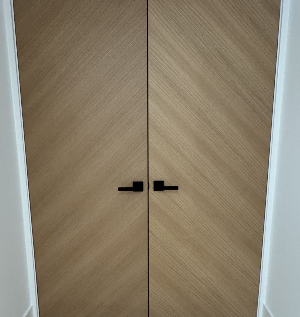Custom wood doors with chevron grain pattern