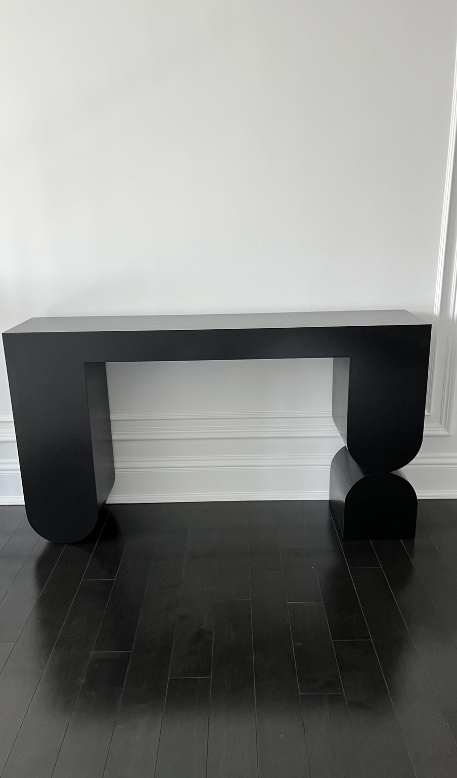 Sculptural black console table