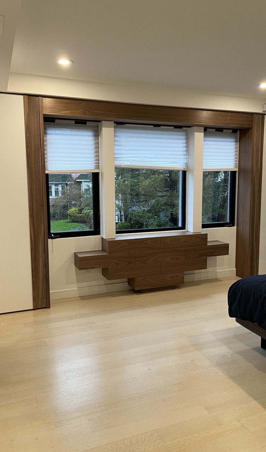 Custom wood media wall with integrated window surround